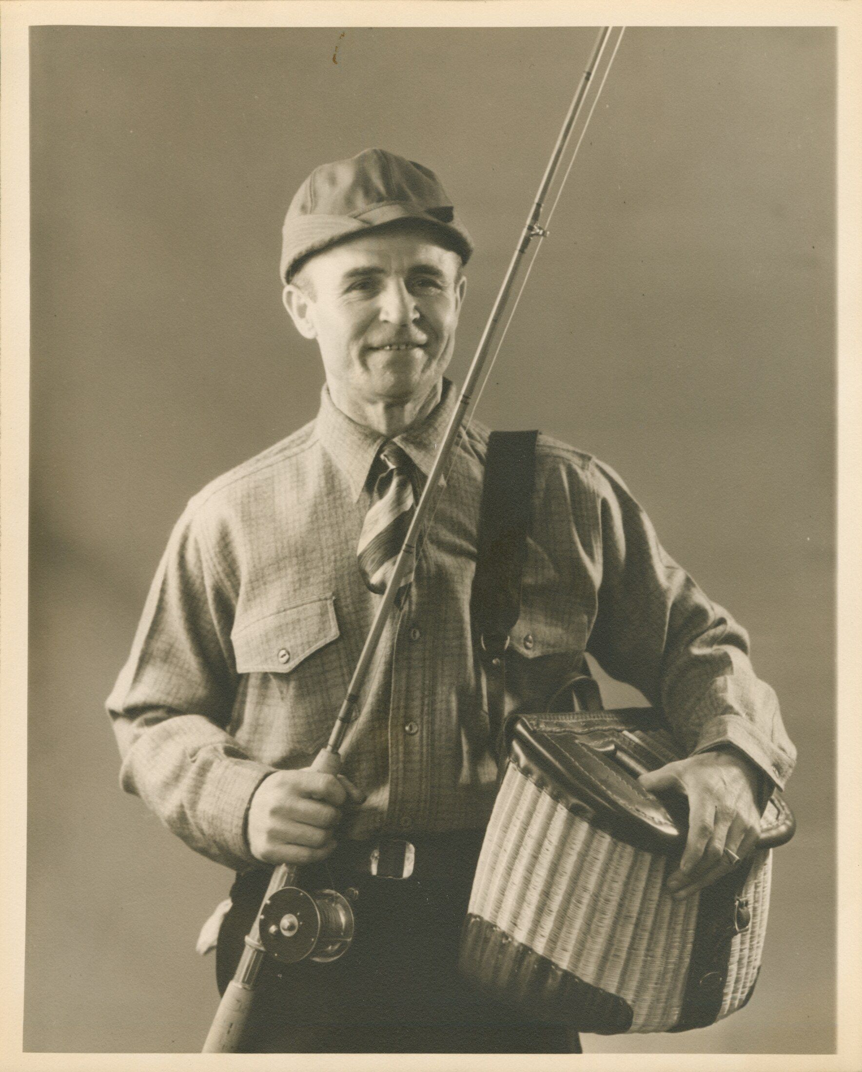 Eddie Bauer posing with his outdoor gear